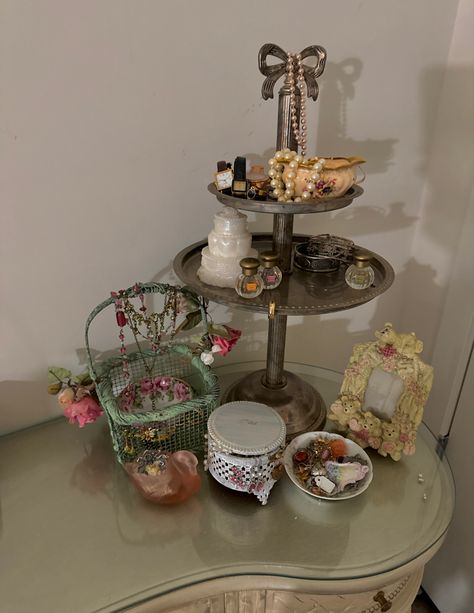 #coquette #vanity #shabbychicdecor #eclectic #jewelry #makeup #teacup Aesthetic Makeup Vanity Decor, Jewelry Organizer Coquette, Vintage Makeup Organization, Aesthetic Jewelry Organizer, Coquette Jewelry Holder, Vintage Makeup Organizer, Makeup Organizer Aesthetic, Cottagecore Vanity, Jewelry Organizer Aesthetic