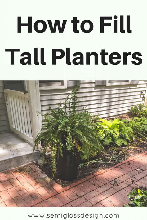 The easiest way to fill tall planters without actually filling them! It only takes a few seconds and you can swap plants as often as you want. What To Plant In Tall Planters, Tall Square Planters Front Porch, Tall Potted Plants Outdoor Patio, Tall Planters Front Door Ideas, Plants In Tall Planters, How To Fill A Tall Planter Front Porches, How To Plant In A Tall Planter, Tall Outdoor Plants In Pots, Front Door Tall Planter Ideas