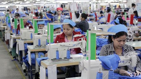 Garment workers sew clothes at Grand Twins International Factory earlier this year.  Vireak Mai Bodies Exhibit, International Workers Day, Factory Worker, Workers Day, Garment Workers, Clothing Factory, Garment Industry, Garment Factory, 2024 Vision