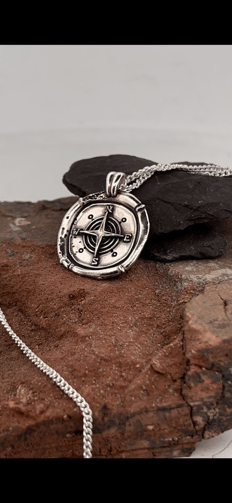 The Grunge Aged Compass Necklace. The Compass Necklace in sterling silver is a must-have for any edgy traveler. The aged pendant is 23mm wide and uniquely handmade in the UK, adds a touch of uniqueness to your style. The 18" chain makes it a perfect fit for any outfit. Crafted with precision and quality materials, the Compass Necklace features an aged pendant that exudes character and style. Its edgy design is perfect for any fashion-forward traveler looking to make a statement. The necklace's u Grunge Jewellery, Grunge Necklaces, Gothic Necklaces, Ashes Jewelry Cremation, Compass Jewelry, Forever Necklace, Ashes Ring, Fingerprint Necklace, Handwriting Necklace