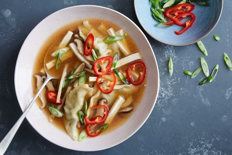 A Chinese take-out staple, hot and sour soup is super easy to create at home — and comes together in just 15 minutes This weeknight version bolsters the traditional mushrooms and tofu with the addition of store-bought pork dumplings, but you could just as easily use chicken or vegetable dumplings, depending on your preference Cornstarch gives the broth its velvety texture, vinegar adds verve, and white pepper adds subtle complexity, though black pepper is a perfectly fine substitute Vegetable Wontons, Beef Dumplings, Wonton Soup Recipe, Chinese Beef, Vegetable Dumplings, Dumpling Soup, Pork Dumpling, Mapo Tofu, Hot And Sour Soup