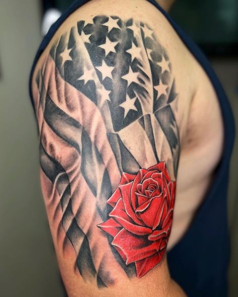 Shoulder American Flag Tattoo With A Rose American Flag Tattoo Design, Flag Tattoo Design, We The People Tattoo, People Tattoo, Patriotic Tattoos, Rose Tattoos For Men, Saved Tattoo, Flag Tattoo, Stomach Tattoos