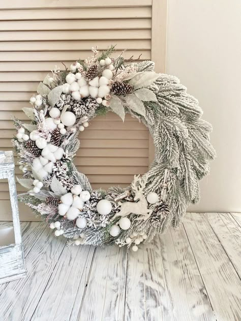 Beautiful winter wreath for front door white. The wreath is decorated with artificial twigs, pinecones, artificial apples, sheaves from branches white berries and natural cotton. The diameter of the wreath is 20 in. A wreath can adorn your door all winter. Care: Recommended for indoor or covered outdoor use. See other Christmas wreath you can see by clicking on the link: https://www.etsy.com/shop/HomeBeautyDecor?ref=seller-platform-mcnav&section_id=24038466 See other wreaths you can see by clicking on the link: https://www.etsy.com/shop/HomeBeautyDecor?ref=seller-platform-mcnavPayment-I accept only Paypal Please note! Parcel will go to you depending on your location. - USA: 2 - 4 weeks - Canada: 2-5 weeks - Australia: 3-6 weeks - Europe: 2-3 weeks - Japan 2-3 weeks January Door Wreaths, White Winter Wreaths For Front Door, Winter Wreath Ideas After Christmas, White Wreaths For Front Door, January Wreath Ideas, White Twig Wreath, January Wreath, Winter Wreaths For Front Door, Front Door White