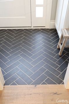 Herringbone Tile Front Entrance, Kitchen Flooring Ideas Next To Hardwood, Kitchen Floor Herringbone Tile, Charcoal Herringbone Tile Floor, Foyer Floors Ideas Entryway, Slate Tile Laundry Room, Mudroom Tile Ideas, Front Entrance Flooring Ideas, Herringbone Tile Entryway