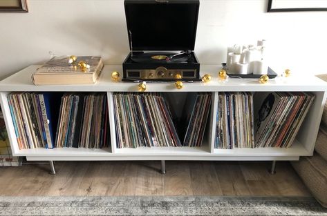 I'm no handy-woman by any definition of the word, but with limited tools, I made this low vinyl record shelf work. It's a 100% IKEA hack. Vinyl Record Storage Ikea, Ikea Record Storage, Modern Record Console, Ikea Tv Unit, Ladder Shelf Diy, Vinyl Record Shelf, Ikea Tv, Pool Table Room, Record Shelf