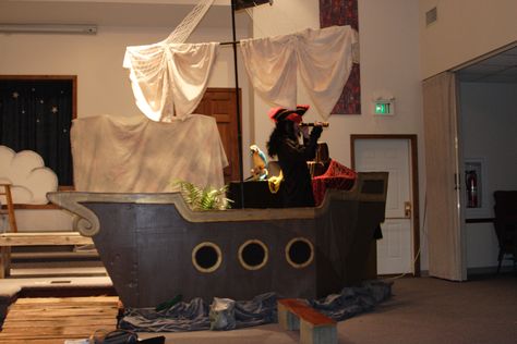 Peter Pan Set Design:  Cardboard ship with sail and plank Peter Pan Play, Stroller Costume, Cardboard Pirate Ship, Pirate Halloween Decorations, Peter Pan Jr, Peter Pan Party, Diy String Lights, Peter Pan And Tinkerbell, Pirate Theme Party