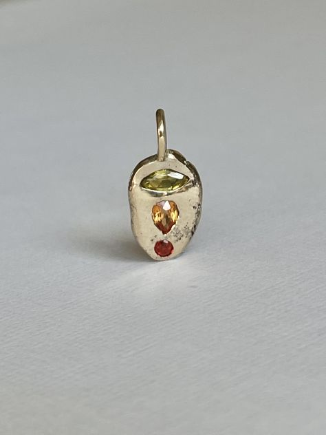 One of a kind, handmade sunrise sapphire pendant. A marquaise, pear (sapphire) and round (ruby) set in molten organic 9ct gold. A raw interpretation of a Sydney sunrise by the ocean in sapphire form. Stones: 0.45ct total. Yellow marquaise sapphire, orange pear sapphire & round red ruby. Material: 9ct solid yellow gold Length: 18mm Pendant is sold alone, as is. Yellow Stone Jewelry, Cool Pendants, Lost Wax Jewelry, Recycled Necklaces, Ruby Set, Round Pendant Necklace, By The Ocean, Dope Jewelry, Sapphire Pendant