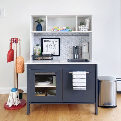 About – Life In Mom Jeans Ikea Play Kitchen Water Pump, Montessori Kitchen Station With Mini Fridge, Ikea Functional Play Kitchen, Functional Kids Kitchen, Montessori Kitchen Station, Montessori Snack Station, Contact Paper Cabinets, Montessori Space, Ikea Kids Kitchen