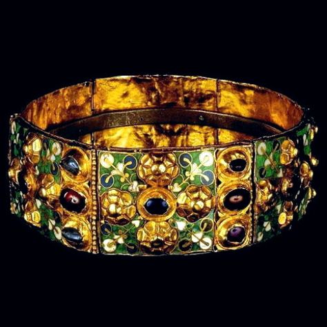 THE IRON CROWN. 700 - 780 AD. Gold , precious stones, enamel, iron. The Iron Crown is so called from a narrow band of iron about one centimeter (three-eighths of an inch) within it, said to be beaten out of one of the nails used at the crucifixion. According to tradition, the nail was first given to Emperor Constantine I by his mother Helena, who discovered the cross of the Crucifixion. How it fell into the hands of the Lombard kings, Germanic conquerors of northern Italy, is not well explai... Iron Crown, Early Middle Ages, Art Ancien, Medieval Jewelry, Cary Grant, Royal Jewels, Ancient Jewelry, Ancient Artifacts, Crown Jewels