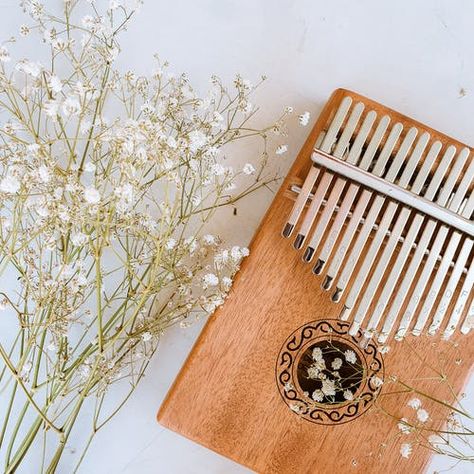 #Kalimba #aesthetic #flowers#music Kalimba Pictures, Alat Musik Aesthetic, Marimba Aesthetic, Kalimba Aesthetic, Aesthetic Instruments, Musical Instruments Aesthetic, Thumb Piano, Finger Protector, Aesthetic Flowers