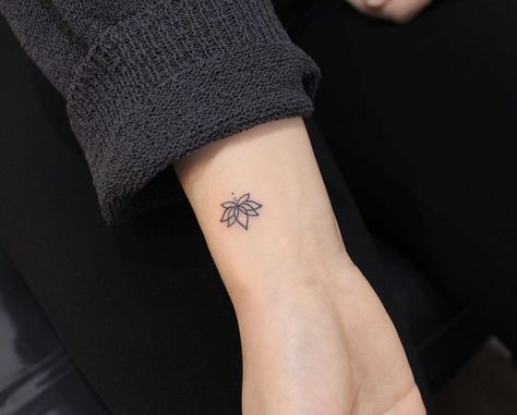 30 Lotus Tattoo Ideas That Symbolize Purity & Enlightenment | 30 Lotus Tattoo Ideas These lotus tattoos symbolize personal growth and enlightenment! Lifestyle Purity Tattoo Symbols, Men Lotus Tattoo, Self Growth Tattoo Ideas Small, Self Growth Tattoo Ideas For Women, Tattoos Symbolizing Growth, Lotus Flower Tattoo Men, Lotus Tattoos For Women, Lotus Flower Wrist Tattoo, Lucky Tattoo Symbols