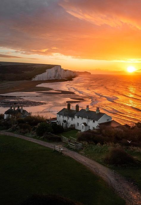 Sunset over the Seven Sisters Cliffs and the coastguard cottages in East Sussex, England - UK Seven Sisters Cliffs, Weather Like Today, Seven Sisters, Plane Travel, England Uk, East Sussex, Natural Earth, Landscape Photos, Travel Around The World