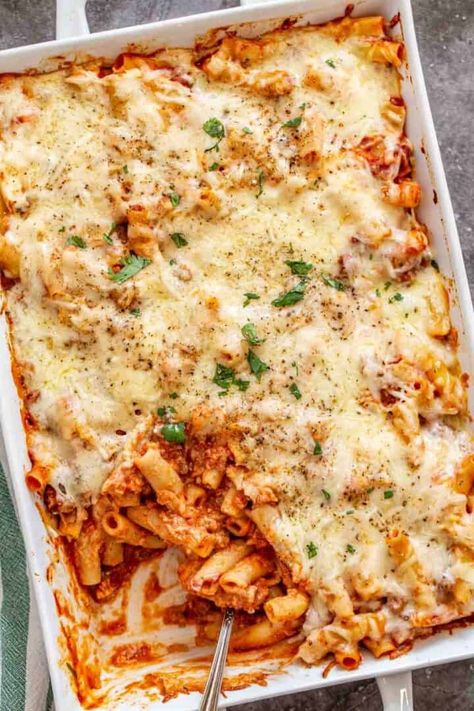 This meaty baked ziti with ricotta is the perfect comfort food. Cheesy pasta made flavorful with tender beef chunks. This casserole takes little prep and the results are incredible! Baked Pasta Ricotta Cheese, Easy Baked Ziti With Ground Beef And Ricotta, Easy Baked Ziti With Ground Beef, Baked Ziti With Ground Beef And Ricotta, Ground Beef Ricotta, Recipe With Ricotta Cheese, Baked Ziti With Ground Beef, Recipe With Ricotta, Baked Ziti With Ricotta