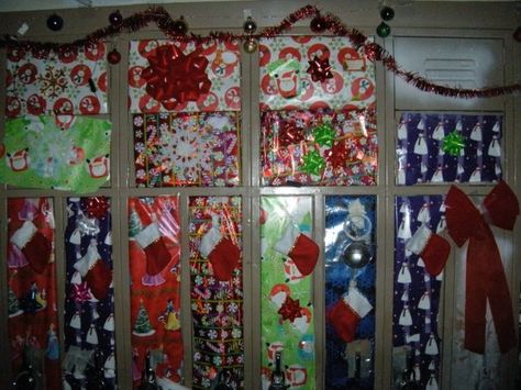 At my high school we celebrated Christmas in a special way. All of the seniors had their lockers in two hallways and one day after school was the annual "LOCKERATION" when all of the seniors stayed to decorate their lockers and hallways for the season. Our teachers handed out cookies and hot chocolate, while Christmas music played over the speakers. It was something younger students waited 4 years to do and one of the fondest memories I have from high school. Locker Christmas Decorations, Christmas At School, Cookies And Hot Chocolate, Cheerleading Signs, Rally Idea, Basketball Decorations, Great Spirit, School Locker, Locker Decorations