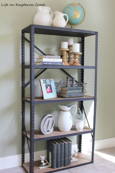 How to create an industrial book shelf from an old metal shelving unit and some pine boards. A little paint and stain goes a long way! Diy Industrial Bookshelf, Farmhouse Thrift Store Makeovers, House Minimalist, Thrift Store Upcycle, Shop Shelving, Rustic Bookshelf, Diy Bookshelf, Industrial Bookshelf, Metal Shelving