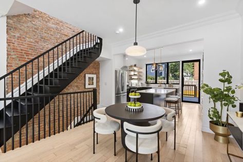 Rare and Historic Row House with Immaculate Upgrades Now Listed in Bergen Hill, JC | Jersey Digs Row House Kitchen, Row Home, Glass Stairs, Oak Shelves, Row House, Exterior Brick, Oak Floors, Open Plan Living, Modern Dining Room