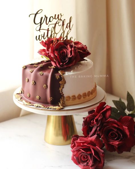 Timeless elegance captured in cake form ✨ This ‘Grow Old with Me’ creation combines rich maroon and delicate white, accented with golden details for a truly luxurious look. Perfect for anniversaries or any special occasion where love takes center stage. Every detail, hand-crafted with care at The Baking Mumma 💕 Looking for a bespoke cake that tells your unique story? WhatsApp to order your custom design today! 🎂🍰 #TheBakingMumma #LuxuryCakes #CustomCakeDesign #HomeBakerLife #AnniversaryCakes Maroon Cake, Wedding Cakes Maroon, Cake Form, Grow Old With Me, Indian Theme, Wedding Backdrop Design, Grow Old, Theme Cake, Love Anniversary