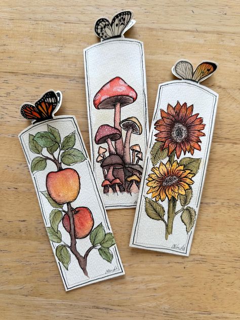 Beautifully detailed bookmarks measuring approximately 6.5x2 inches, including 3d butterfly. Bookmarks are made of high quality watercolor paper and thick cardstock for strong durability. Handdrawn and handpainted, these bookmarks are each unique, made special for you! By Chloe Making Your Own Bookmarks, Watercolor Crafts To Sell, Fall Arts And Crafts For Adults, Bookmark Collage, Breaks Books, Cute Diy Bookmarks, Bookmarks Handmade Creative, Unique Bookmarks Handmade, Diy Bookmarks Aesthetic