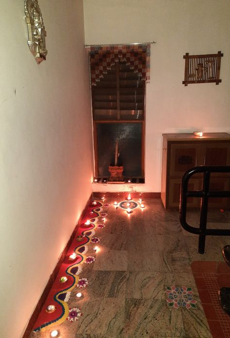 Border rangoli with lamps at the house entrance Aesthetic Rangoli, Pookalam Design, Border Rangoli, Diwali Decor, Diwali Decorations, House Entrance, Festival Decorations, Diwali, Festival Season