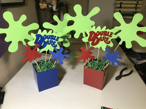 Double Dare Nickelodeon slime Party centerpieces - custom order from FavorSplash https://www.etsy.com/shop/FavorSplash 90s Nickelodeon Party Decorations, Nickelodeon Party Decorations, Nickelodeon Decorations, Double Dare Party, Nickelodeon Birthday Party Ideas, Double Dare Birthday Party, 90s Nickelodeon Party, Obstacle Course Party, Nickelodeon Party