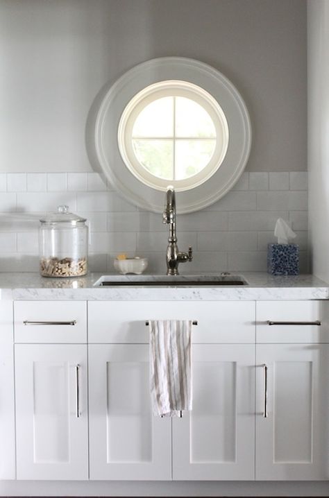 Window Between Rooms, Internal Window Between Rooms, Port Hole Window, Beveled Subway Tile Backsplash, Internal Window, White Subway Tile Kitchen, Window Over Sink, Marble Backsplash Kitchen, Trendy Kitchen Tile