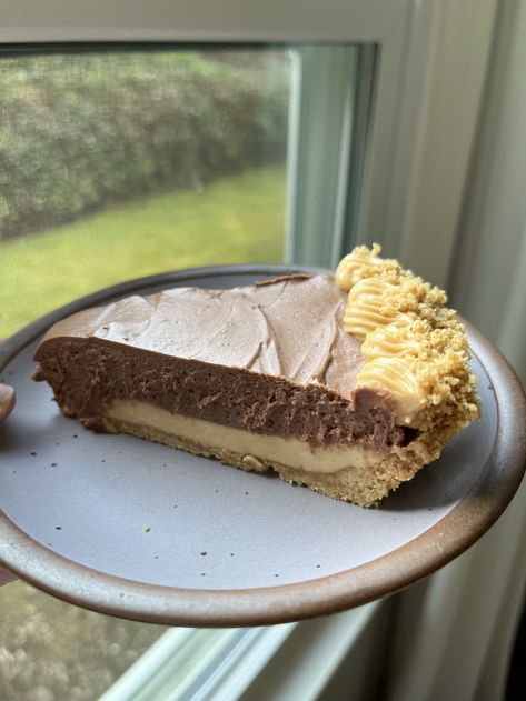 Someone holding up a plate of Copycat Costco chocolate peanut butter pie. Peanut Butter Chocolate Pie, Cooking Sweets, Fabulous Desserts, Peanut Butter Marshmallow, Chocolate Peanut Butter Pie, Chocolate Pie Recipes, Frozen Cookie Dough, Delicious Deserts, Chocolate Cream Pie