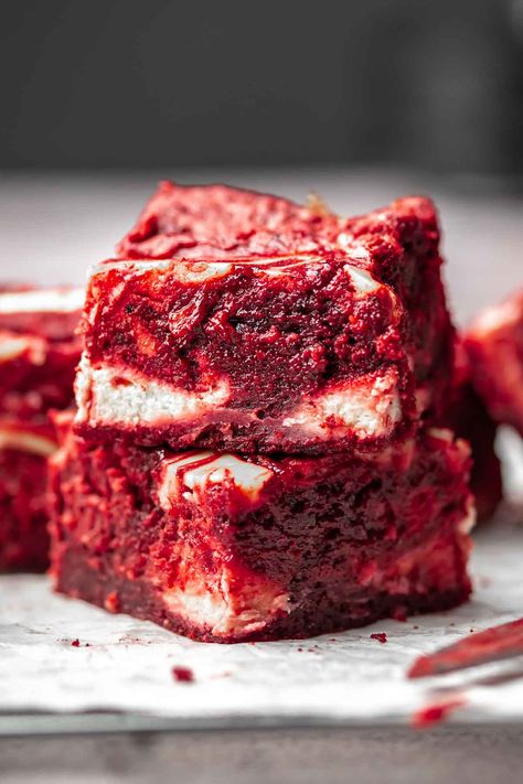 Homemade red velvet brownies feature a sweet and tangy cream cheese swirl, creating a moist and chewy texture. With the vibrant red color, these brownies are an ideal treat for Valentine's Day, with all the classic flavors of traditional red velvet cake, enhanced by oil for moisture, cocoa powder for depth, and a creamy cheesecake filling swirled into the batter. Traditional Red Velvet Cake, Red Velvet Bars, Brownies With Cream Cheese, Velvet Desserts, Summer Potluck Recipes, Red Velvet Cheesecake Brownies, Cake Mix Brownies, Red Velvet Desserts, Cream Cheese Swirl