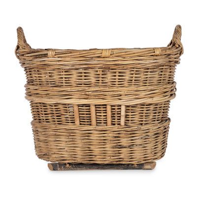 The Linge Basket is an exact reproduction of a French Champagne basket used to harvest grapes in the champagne fields of Northern France. Woven of rattan, it is ideal for storing books, games, toys, laundry and more. | Bobo Intriguing Objects Linge Wicker Basket 27.0 H x 28.5 W x 22.8 D in Wicker in Brown | 22.8" L x 28.5" W x 27.0" H | Wayfair | Organization Champagne Basket, Creole Cottage, Vintage Wicker Baskets, Northern France, Basket Uses, Basket Case, Laundry Care, Wood Basket, Storing Books