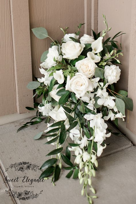 Greenery Cascade Bouquet, White Bridal Bouquet With Greenery Cascading, White Rose Cascading Bouquet, Green And White Bridal Bouquet Cascade, Green And White Wedding Bouquet Cascade, Calla Lily And Eucalyptus Bouquet, White Roses And Lilies Arrangements, Wedding Bouquet Waterfall, Cascading White Wedding Bouquets