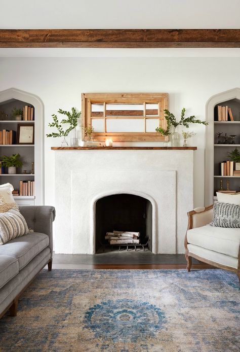 Simple fireplace in cottage living room.  Come get inspired by Tranquil and Timeless Tudor Design Details From a Serene 1920s Texas Cottage renovated on HGTV's Fixer Upper by Chip and Joanna and known as the Scrivano House. 1920s Cottage, Salons Cottage, Tudor Design, Simple Fireplace, Basement Remodel Diy, Natural Wood Flooring, Cottage Living Rooms, Magnolia Market, Fireplace Remodel