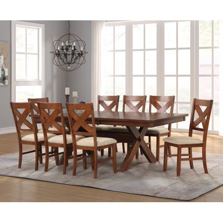 Give your dining area a warm, welcoming update with the Roundhill Furniture Karven Wood 9-Piece Dining Set, Extendable Trestle Dining Table with 8 Chairs, Dark Hazelnut. This table expands at the center to make room for an included 18-inch leaf perfect for adding enough space at your next gathering for your guests to enjoy good food and good company. This dining table features a solid rubberwood base that's reliably designed to build family meal memories around. The trestle base adds a little vi Modern Farmhouse Dining Table, Dining Table With Leaf, Wood Dining Room Table, Trestle Dining Table, Trestle Dining Tables, 7 Piece Dining Set, Dining Room Bar, Table And Chair Sets, Rustic Dining