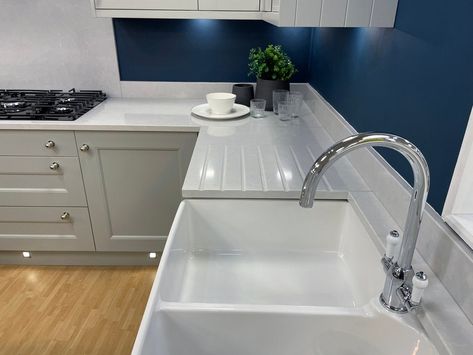 Looking for a durable, nonporous, and attractive new countertop option? Corian countertops cost from $2,200 to $5,000, with many homeowners spending $3,475 on average. Countertop Repair, Corian Kitchen Countertops, Cost Of Countertops, Rustic Kitchen Backsplash, Durable Countertops, Patterned Tile Backsplash, Corian Countertops, Corian Solid Surface, Unique Kitchen Backsplash