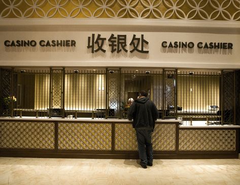 A man stands at the casino cashier in the Lucky Dragon hotel-casino, 300 W. Sahara Ave., on Friday, Nov. 18, 2016. Las Vegas’ newest casino, which will cater to Asians, is schedule to open tomorr … Casino Cashier, Lucky Dragon, Casino, Las Vegas, Hotel