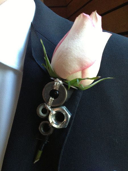 Unique boutonniere featuring washers and nuts.  The ultimate in manly. Wedding flowers created by Brooke Raulerson of Amelia Island Wedding Flowers, *An Artistic Florist Company. www.ameliaislandweddingflowers.com Wrench Boutonniere, Mechanic Wedding, Automotive Themed Wedding, Mechanic Boutonniere, Unique Boutonniere, Mechanics Wedding Theme, Mechanics Wedding, Guitar Pick Boutonniere, Bullet Casing Boutonniere