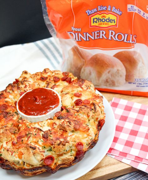 Pepperoni Pizza Monkey Bread is the best make ahead after school snack, party treat, or game day appetizer! Soft rolls tossed in seasonings, pepperoni, and cheese baked till melty on the inside and nice and crusty on the outside. #ad #Back2School #RhodesBread #BacktoSchool #MonkeyBread #Pizza Rhodes Dinner Roll Pizza, Rhodes Pizza Rolls, Pepperoni Monkey Bread Pull Apart, Rhodes Pepperoni Rolls, Pepperoni Rolls With Rhodes Rolls, Rhodes Rolls Pizza, Pepperoni Monkey Bread, Pepperoni Pizza Monkey Bread, Appetizer Night