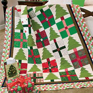 The whole family will want to snuggle under this cheerful Christmas holiday Pines & Presents lap quilt. The pattern is as much fun to make as it is to display! Christmas Lap Quilt, Tree Quilt Block, Floral Quilts, Mccalls Quilting, Lap Quilt Patterns, Christmas Quilt Patterns, Quilt Block Patterns Free, Holiday Quilts, Tree Quilt