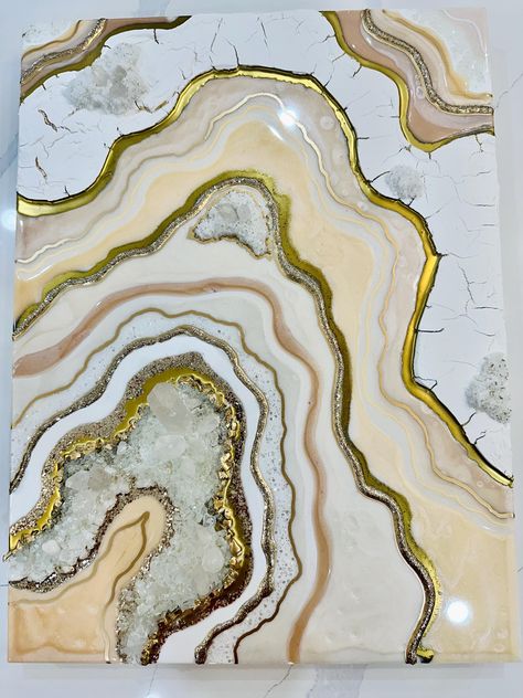 Dive into a world of luxury and elegance with our Customizable White and peach Gold Epoxy Resin Geode Wall Art. Infused with genuine crystals and accented by shimmering gold details, this art piece not only adorns your wall but also brings a touch of ethereal beauty to your space. Stunning one of a kind crystal geode painting in pearl white, champagne, peach with gold undertone. The Epoxy resin painting measures 24x18" is handmade on gallery style wooden panel of depth 1-1.5 inches. Made with high quality pigments, glitters, glass crystals and real quartz Crystal embedded in multiple layers of resin. The resin flows through the edges giving it an artistic look. The Crystal wall art will be finished with clear coat of resin giving it a glossy and glass like finish.  Due to nature of resin i Resin Geode Wall Art, Epoxy Resin Geode, Luxury Wall Decor, Geode Painting, Geode Wall Art, Geode Wall, Agate Art, Wall Decor Unique, Resin Geode