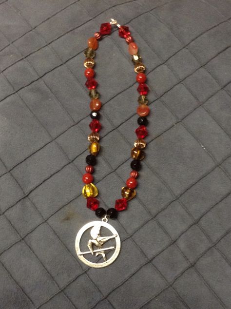 My hunger Games necklace Hunger Games Bracelet Ideas, Hunger Games Bracelet, Hunger Games Necklace, Effie Trinket, Hunger Games Series, Hunger Games, Friendship Bracelets, Craft Ideas, Bracelet