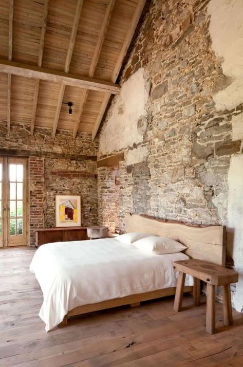 May 4, 2019 - This stunning  redevelopment of a private historical estate is situated on 640 acres of sprawling agricultural land in rural Philadelphia, Pennsylvania. Antique Stone Wall, Rustic Bedrooms, Rustic Italian Decor, Rustic Farmhouse Bedroom, Stone Walls Interior, Rustic Bedroom Design, Guide Design, Rustic Bedroom Furniture, Rural House