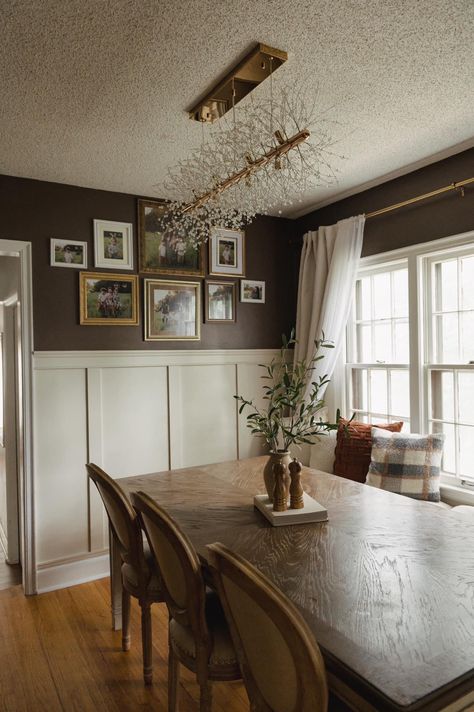 White Paneling Dining Room, Dark Wall Dining Room Ideas, Chairrail Wainscoting Dining Room, Dining Room Chair Rail Wallpaper, Two Tone Wainscoting Paint Colors, Chair Rail In Dining Room, Dining Rooms With Chair Rail, Small Moody Dining Room Ideas, High Wainscoting Dining Room