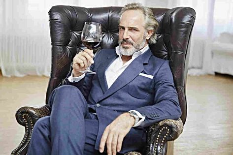 Portrait of a Man with Full Beard sitting in an Armchair holding a Glass of Wine Holding Wine, Pex Tubing, The Family Handyman, Full Beard, Man Sitting, Person Sitting, Family Handyman, Rich People, Cute Texts