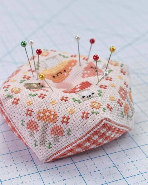 Have you ever made a biscornu? My cross stitch pattern for this unusually shaped pincushion features mushrooms, flowers, gingham, and a teeny mouse friend! Find the pattern in my Etsy shop! #sewistsofinstagram #sewing #stitching #stitchersgonnastitch #biscornu #crossstitchpattern #pincushion #makersbundles Cross Stitch Kawaii, Biscornu Pattern, Kawaii Cross Stitch, Flower Cross Stitch, Craft Things, Cute Cross Stitch, Stitch Art, Hand Embroidery Pattern, Modern Cross Stitch Patterns