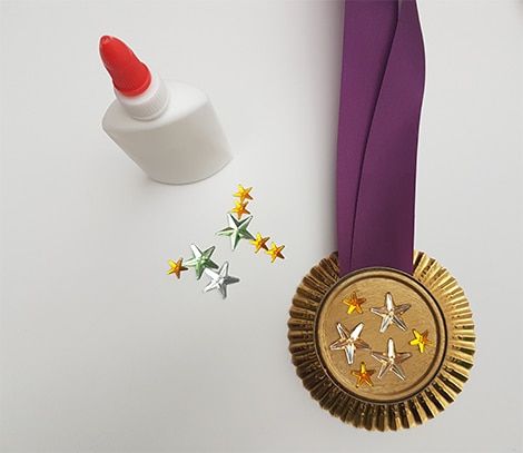 Winter Olympics Craft Idea: Make Your Own Medals | Play | CBC Parents Olympic Medal Craft, Medal Craft, Medal Stand, Olympic Idea, Olympic Crafts, Gymnastics Quotes, Learn Through Play, 2024 Olympics, Vbs 2024