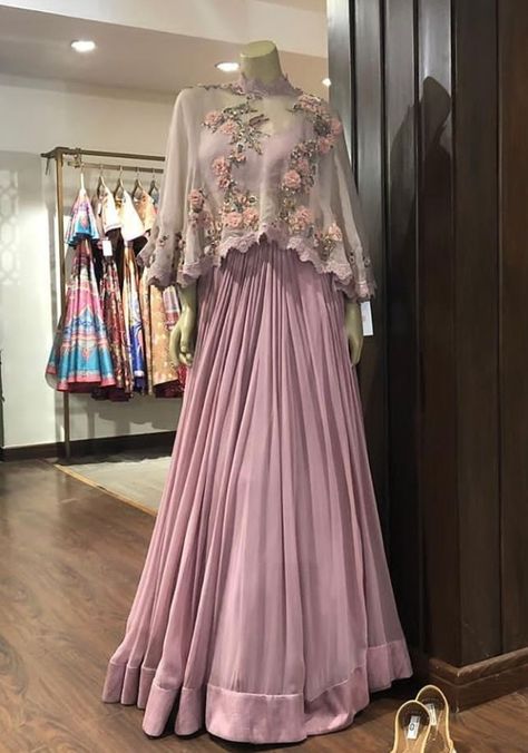 Beautiful Satin-Silk Skirt Lehenga.  Paired with inner blouse and crop top jacket. Embellished with hand embroidery work with zardose and resham work. Stylish with modern silhouettes and traditional embellishments. #dress #silhouettes #indowestern #Gown #Lehenga #Asmairaa #trendy #festival Indowestern Gown, Gown Lehenga, Skirt Lehenga, Indowestern Gowns, Hand Embroidery Work, Indian Wedding Gowns, Crop Top Jacket, Resham Work, Traditional Indian Outfits