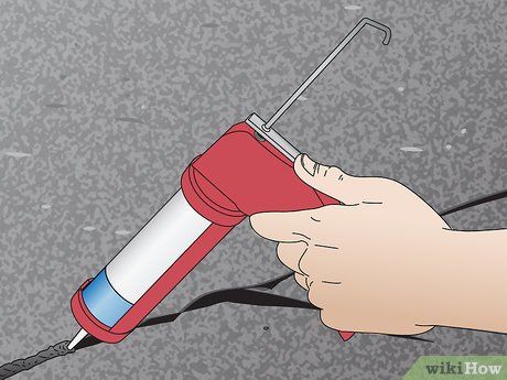 How to Fill Asphalt Cracks (with Pictures) - wikiHow Filling Cracks In Concrete, How To Fill Cracks In Asphalt Driveway, How To Repair Cracks In Concrete Driveway, How To Fix A Cracked Windshield, Asphalt Repair, Remove Oil Stains, Asphalt Driveway, Oil Stains, Compressed Air