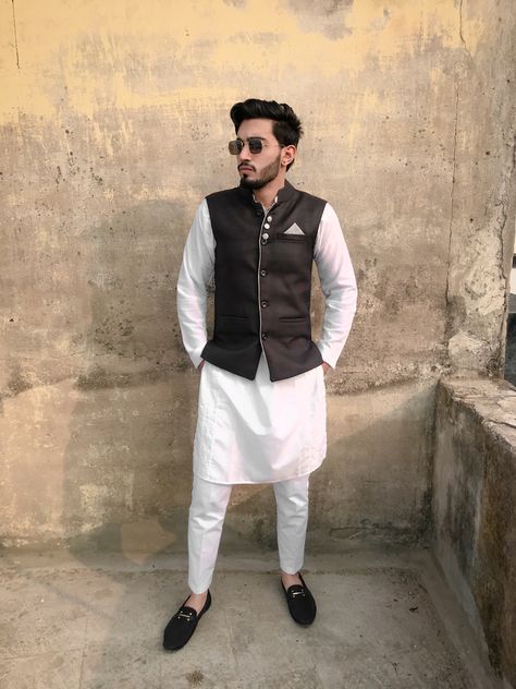 White kurta Set with Black Bandi(waist coat, Nehru jacket) White Kurta Bandi For Men, White Kurta Pajama Men With Jacket, Nehru Jacket For Men Formal, White Kurta Men, Male Wedding Guest Outfit, Brown Suits For Men, Kurta Designs Men's, Wedding Matching Outfits, Pajama Men