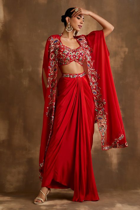 Shop for these amazing collections of Red Silk Crepe And Organza Embroidered Blossom Border Draped Skirt Set For Women by Niamh By Kriti online at Aza Fashions. Reka Bentuk Blaus, Asymmetric Cape, Organza Cape, Haldi Outfits, Function Dresses, Trendy Outfits Indian, Mehendi Outfits, Diwali Outfits, Traditional Indian Dress