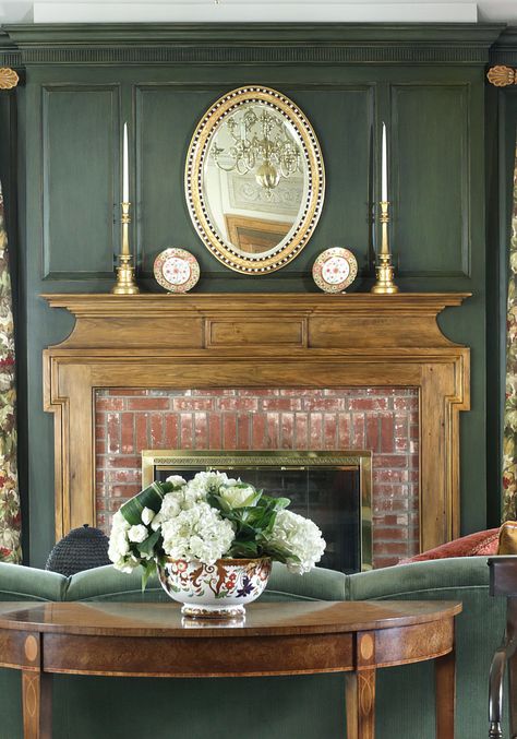 wood fireplace mantel with hunter green wall paneling Wood Paneled Den With Fireplace, Green Wood Wall Paneling, Green Living Room Brick Fireplace, Wood Paneling Over Fireplace, Green Living Room White Fireplace, Hunter Green Fireplace, Forest Green Fireplace, Grandmillenial Style Fireplace, Sage Green Wood Paneling