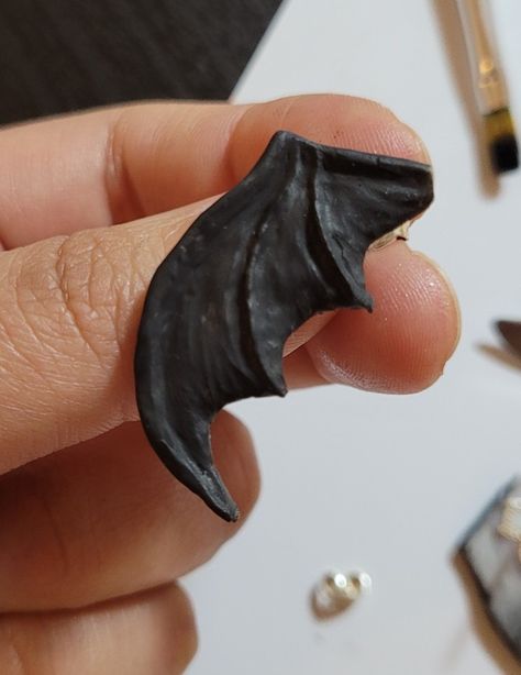 My first ever polymer clay creation 😁 Supernatural Clay Ideas, Clay Wings, Gothic Clay Ideas, Polymer Clay Wings, Bat Clay, Clay Bat, Polymer Clay Bat, Bat Pottery, Polymer Clay Bats