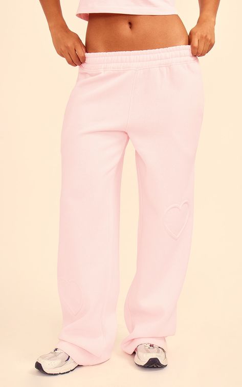 Stay chic and cosy this season in these baby pink heart embossed wide leg joggers. Brought to you in a baby pink hue material with a heart embossed detail and wide leg design, these joggers are calling your name. Pair with the matching top, fresh kicks and your fave headphones for a casual outfit of the day that will turn heads for all the right reasons.   Length approx 78cm/30.5 (Based on a sample size S)   Model wears size S Stores To Shop At For Clothes, Desired Wardrobe, Wide Leg Track Pants, Pink Tracksuit, Dubai Outfits, Wide Leg Joggers, Shopping Wishlist, Pink Sweats, Ibiza Outfits